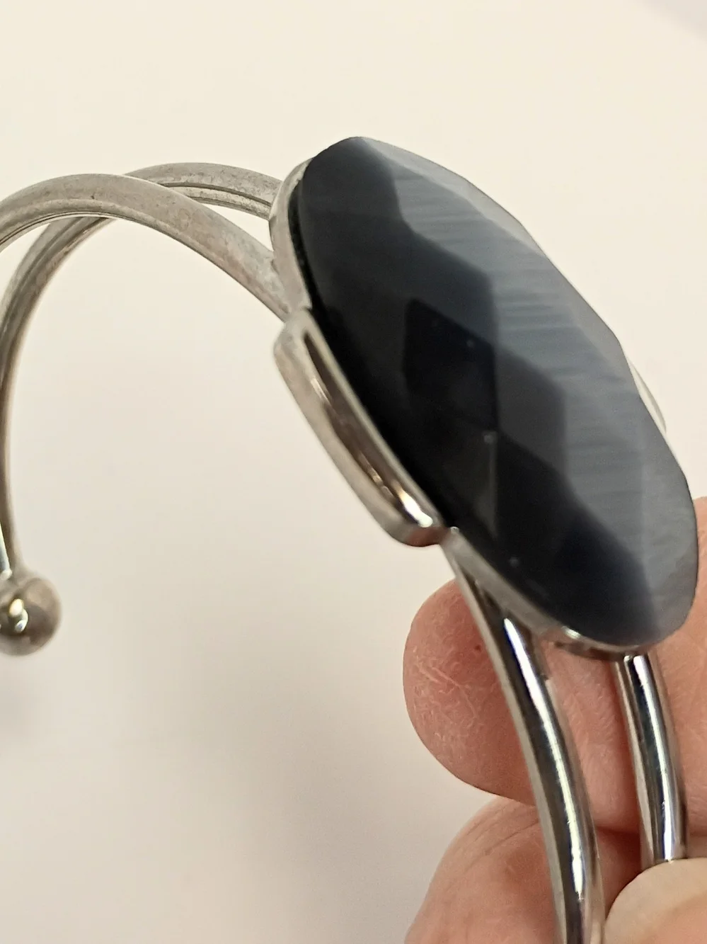 Silver-Tone Bracelet with Faceted Black Oval Center